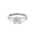 Front view of a 2 CT round cut lab grown diamond ring with a half-bezel setting and pavé band