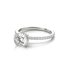 Angled view showcasing the round lab diamond center stone in a white gold half-bezel setting