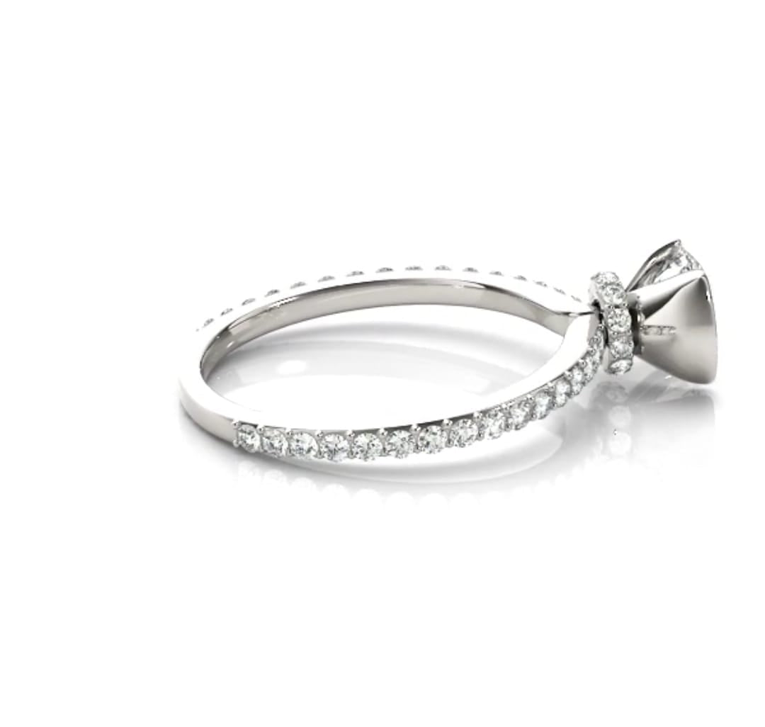 Side profile view highlighting the hidden pavé diamond halo collar underneath the center stone