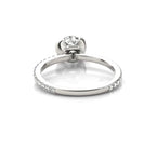 Bottom-up angle showing the inner ring band, bridge connection, and half-eternity pavé diamonds
