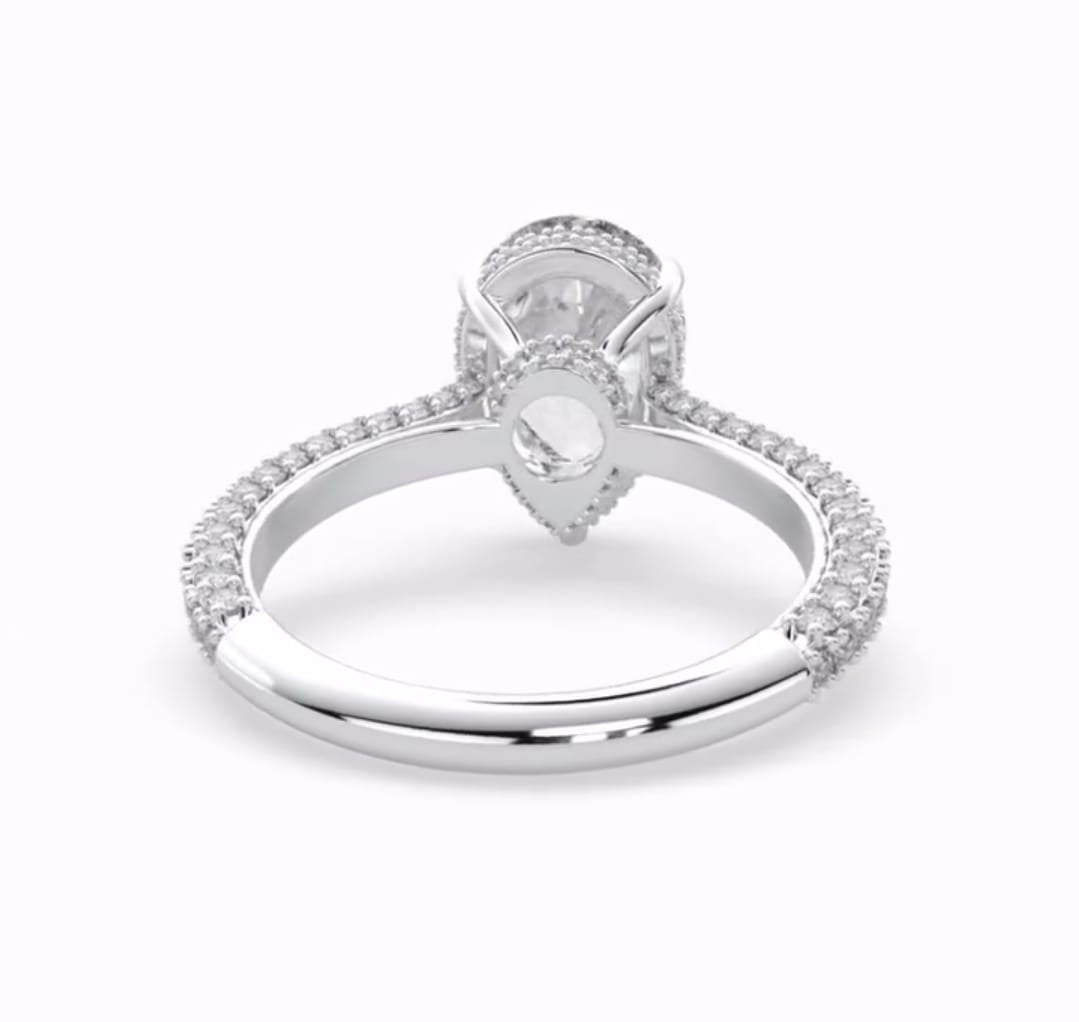 Bottom view detailing the under gallery and white gold band of a 4 carat pear lab diamond ring.