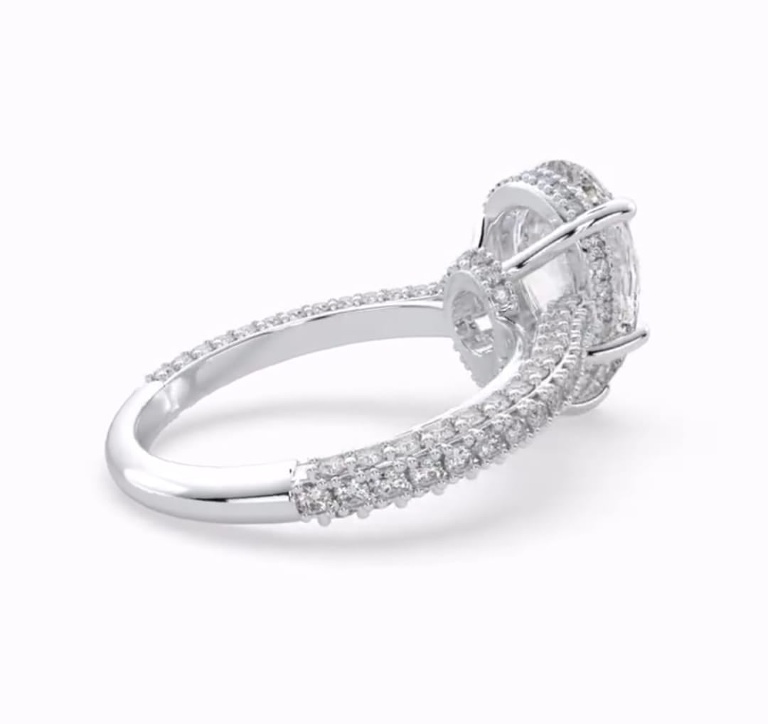 Angled view highlighting the double hidden halo detail beneath a 4 CT pear-cut lab diamond center stone.
