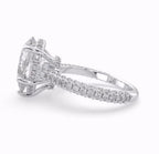 Direct profile view showing the multi-row pavé accent band on a white gold pear engagement ring.