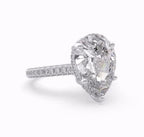 Three-quarter angle of a brilliant 4 carat pear cut lab grown diamond ring.