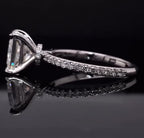 Side profile view of a 2 carat princess cut lab grown diamond ring showing the hidden halo collar and pavé band.