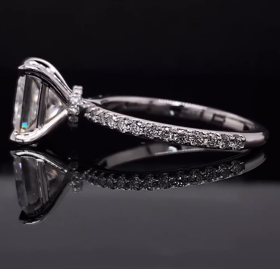Side profile view of a 2 carat princess cut lab grown diamond ring showing the hidden halo collar and pavé band.