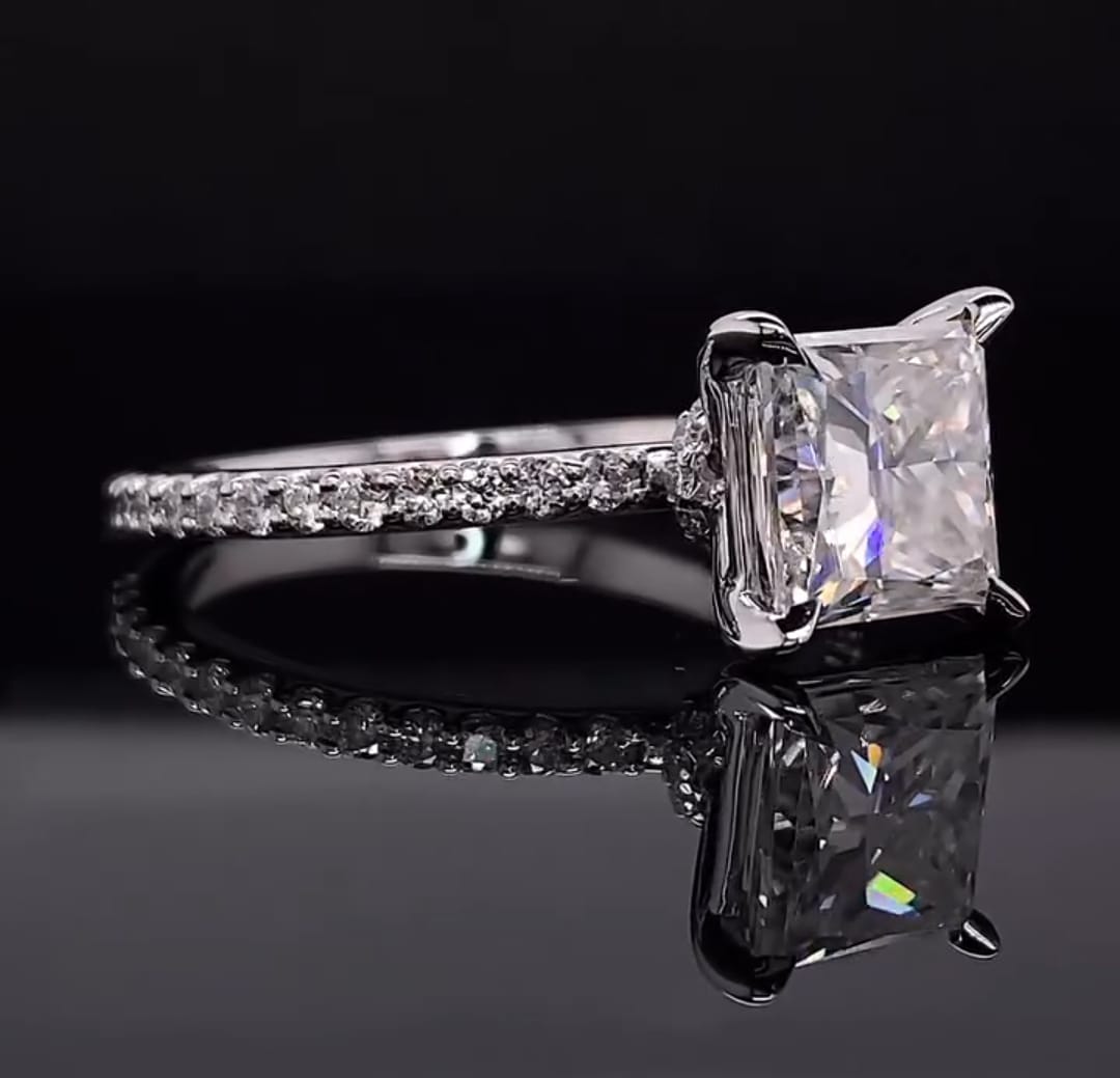 Three-quarter view highlighting the brilliant geometric facets of a 2 carat princess cut lab created diamond.