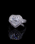 Top view of a 4 carat heart cut lab grown diamond engagement ring with double halo and split pavé band.