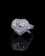 Top view of a 4 carat heart cut lab grown diamond engagement ring with double halo and split pavé band.