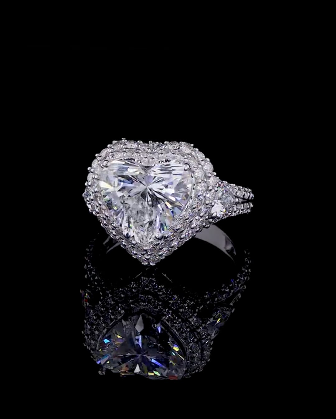Top view of a 4 carat heart cut lab grown diamond engagement ring with double halo and split pavé band.