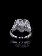 Rear gallery profile showing the ornate diamond-paved bridge and basket support of a heart solitaire halo ring.