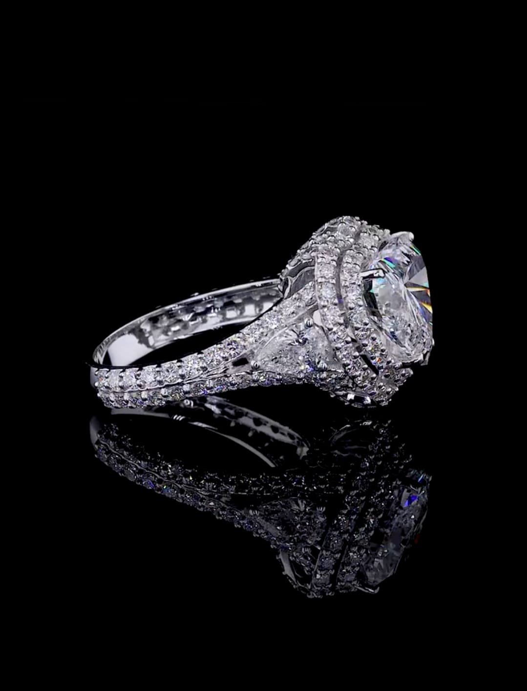 Angled side profile detailing the multi-row diamond split band and double halo crown of the heart ring.