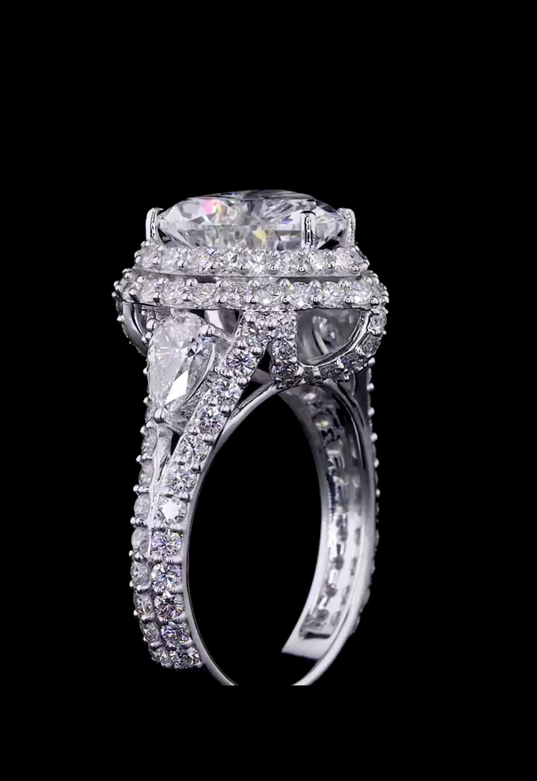 Vertical side profile highlighting the height, pear accent diamond, and pavé setting of a 4 carat heart diamond ring.