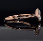 Low-profile side view highlighting the sleek bezel construction and comfort-fit gold band.