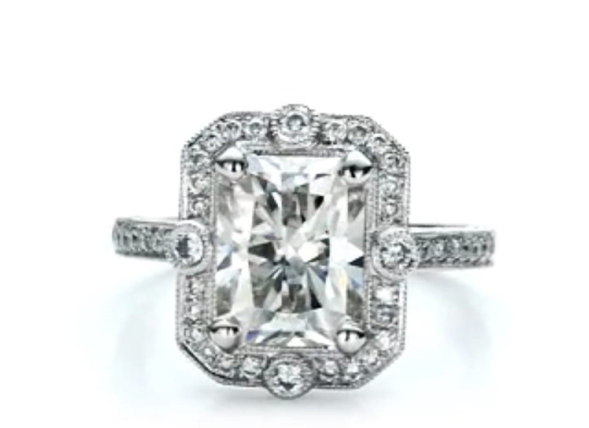 Front view of a 3 carat radiant cut lab grown diamond vintage engagement ring with milgrain halo and bezel accents.