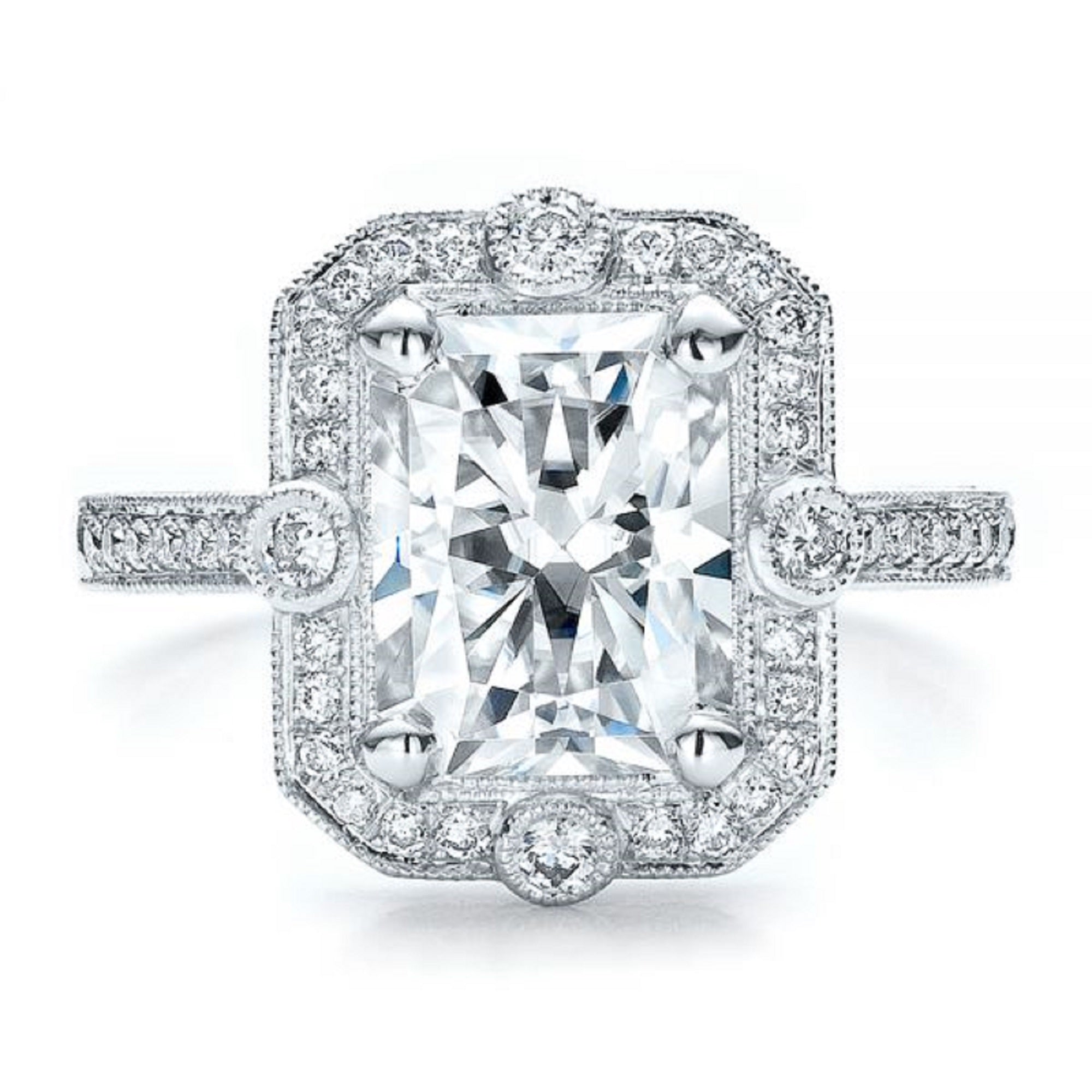 Close-up macro photograph of a 3 carat radiant cut lab grown diamond vintage milgrain halo engagement ring.