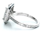 Side profile showing the hand-engraved detailing and pavé diamond band of an antique-style radiant ring.