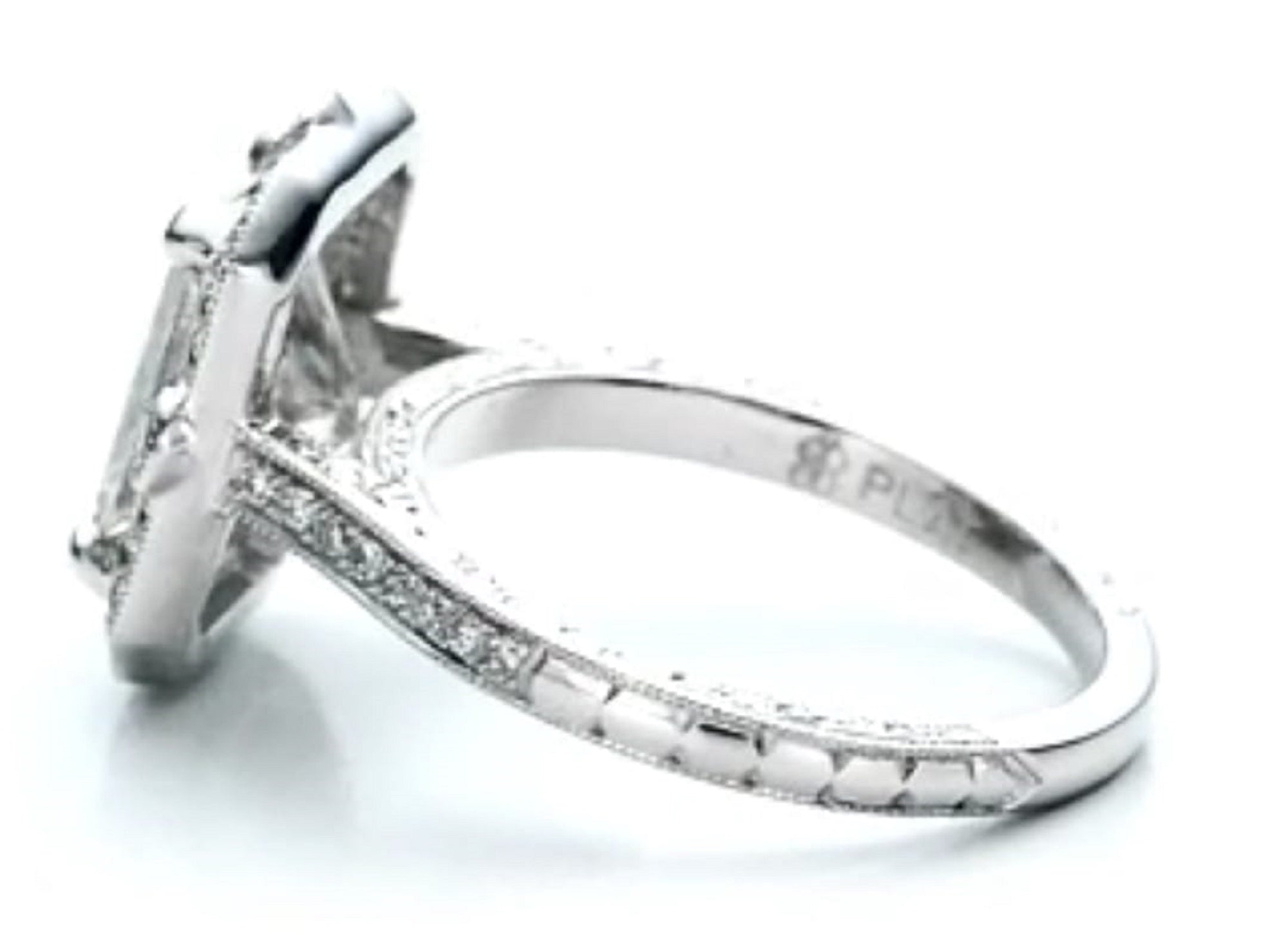 Side profile showing the hand-engraved detailing and pavé diamond band of an antique-style radiant ring.