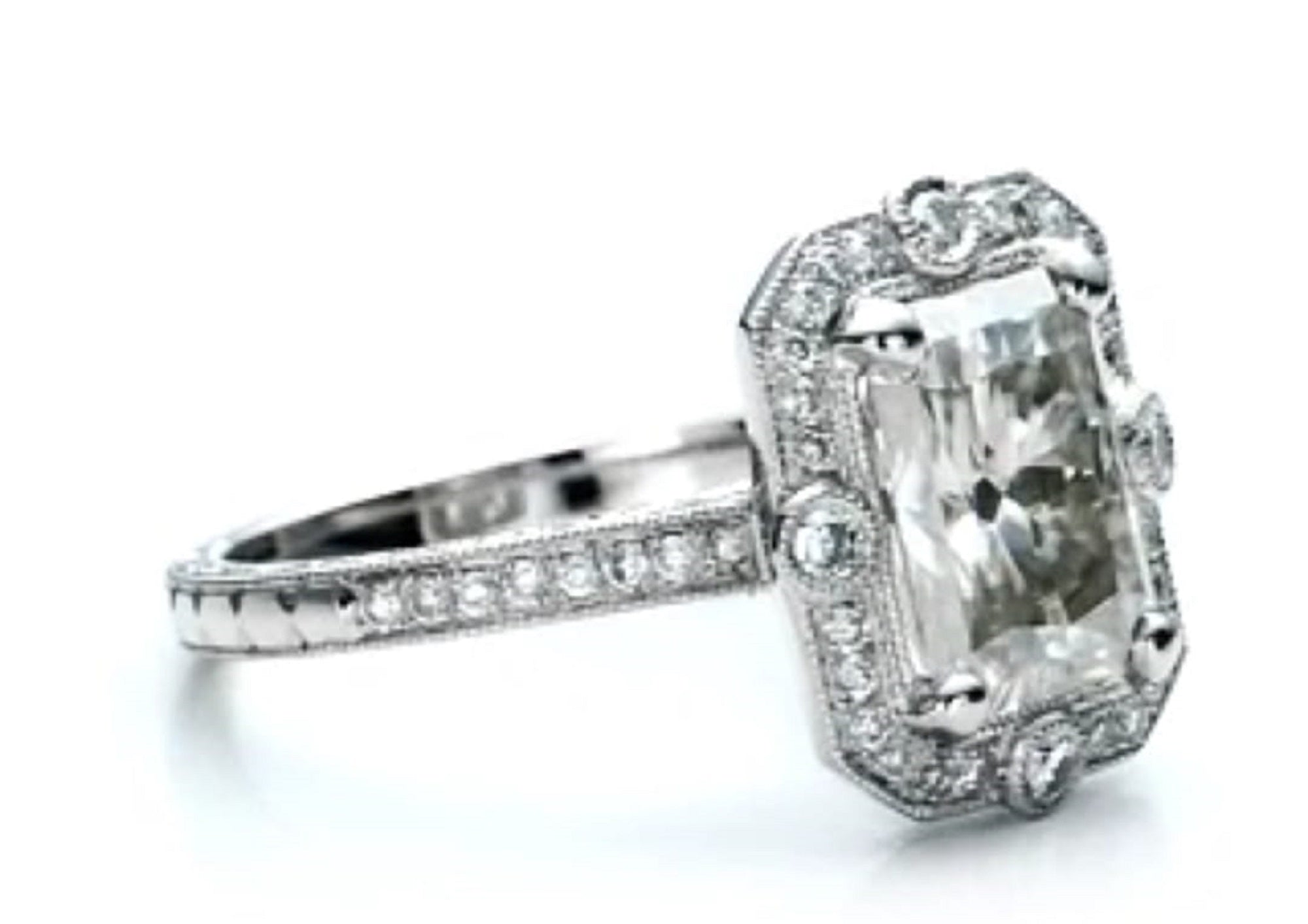 Perspective view of a 3 ct radiant cut lab diamond in a milgrain octagonal halo setting.