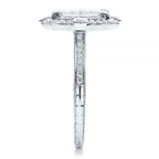 Straight-on top profile view of a radiant cut halo ring detailing the pave band and bezel compass points.