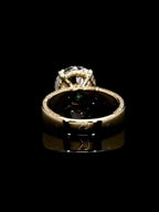 Rear perspective highlighting the inner basket gallery and polished yellow gold shank profile.