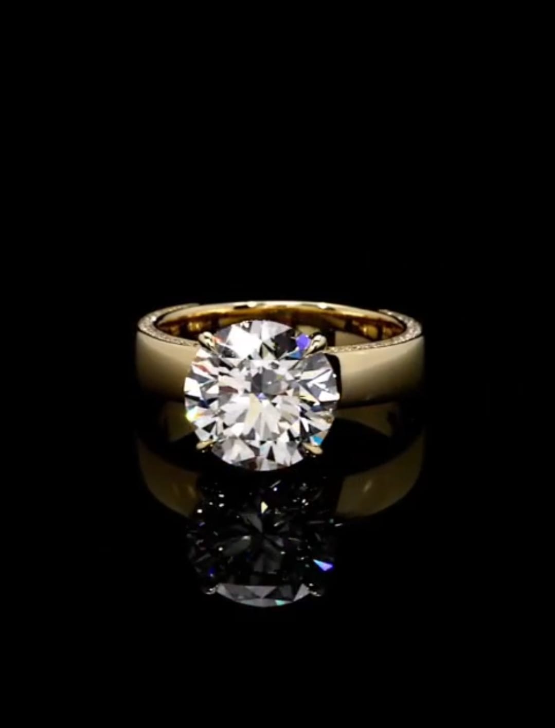 Front face-up photograph showing the cut and symmetry of a 3 ct round lab grown diamond engagement ring.