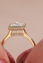 Side profile view showing the hidden halo collar and delicate pavé bridge accent on a 3 CT princess cut bezel ring.
