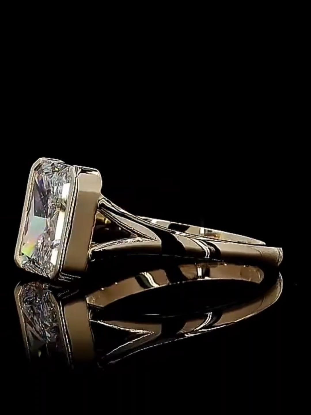 Side view displaying the split-shank band and sleek bezel setting of the 3 carat radiant diamond ring