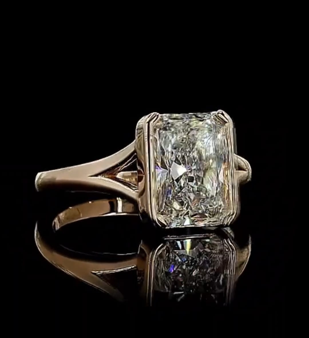 Angled shot highlighting the brilliance and faceted shine of the 3ct radiant cut lab diamond
