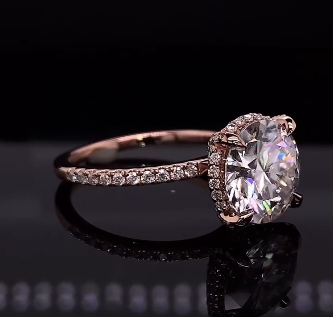Close-up shot highlighting the claw prongs and pave band details on a 4 carat round diamond ring