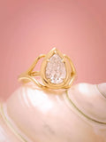 Centered view displaying the teardrop pear cut lab diamond with smooth bezel edge and claw prongs