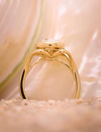 Under-gallery side profile view showing the hollow openwork cathedral split shank of the gold ring