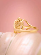 Detailed angled shot of the filigree under-basket and split band architecture of a 3ct pear diamond ring