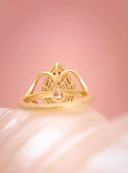 Rear profile showing the smooth gold band and intricate setting underneath the 3 carat pear cut diamond
