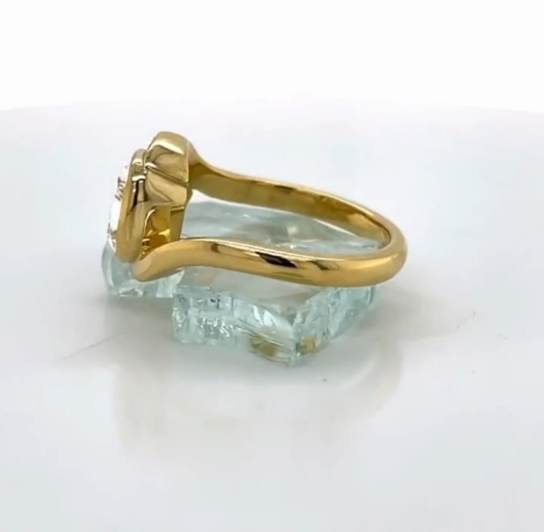 Side profile view displaying the thick gold bypass band and setting construction