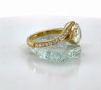 Side view showing the line of micro-pave accent diamonds extending along the curved band