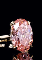 Close up shot of a 3ct oval fancy pink lab grown diamond showing intense color saturation and sparkle