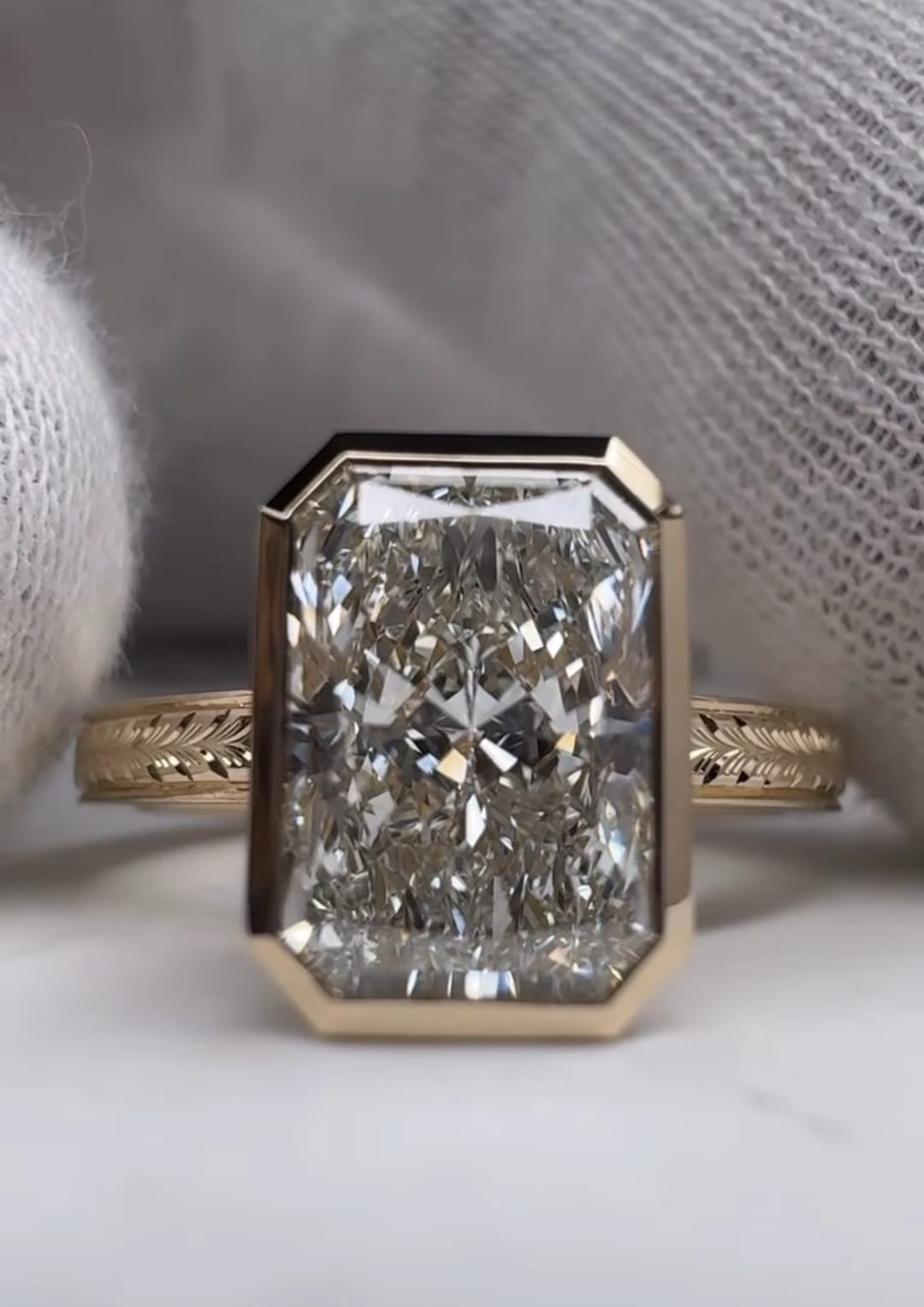 Close-up shot of a 5 CT radiant lab diamond ring showing exceptional facet fire and bezel craftsmanship
