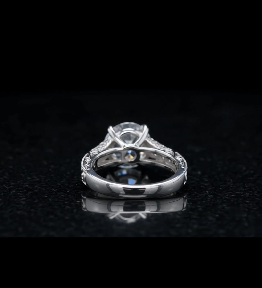 Under gallery view showing the four prong setting and smooth inner band of a 3CT round lab diamond white gold ring