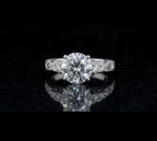 Direct top-down face view of a brilliant 3 carat round lab grown diamond in a vintage engraved white gold ring setting