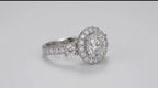 Angled view of a 3 carat round lab grown diamond engagement ring with a diamond halo and side accent stones in white gold
