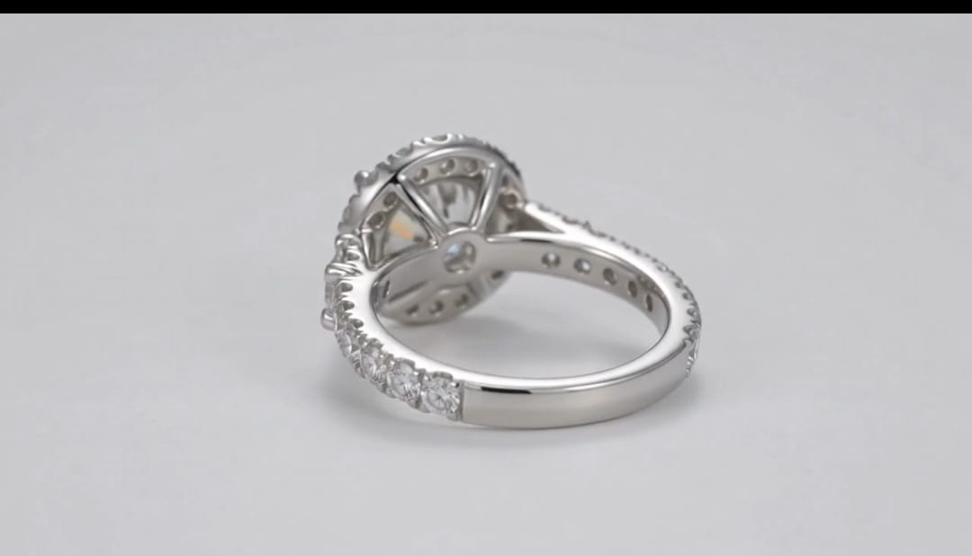 Under gallery view of a 3 CT round lab diamond halo ring showcasing the inner band structure and prong setting