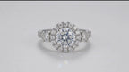 Direct top-down face view of a brilliant 3 carat round cut lab created diamond in a round halo ring setting