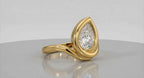 Angled view showing the brilliant 3CT pear lab diamond set in a smooth yellow gold bezel