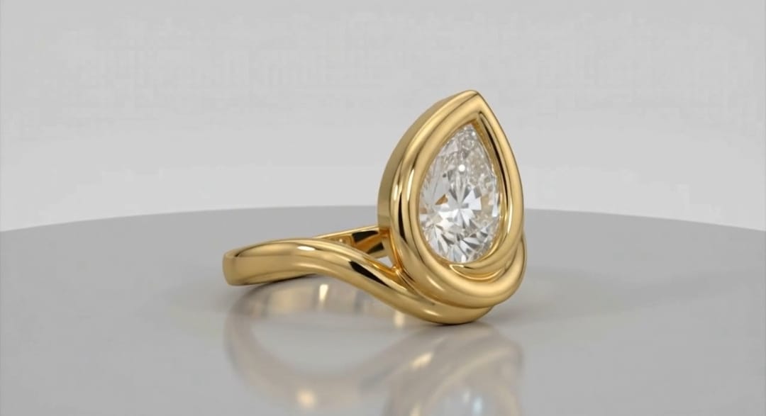 Angled view showing the brilliant 3CT pear lab diamond set in a smooth yellow gold bezel