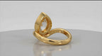 Back view of the curved yellow gold band and bezel setting of a pear lab grown diamond ring