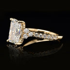 Side angle view showing 3-stone round cluster accent layout next to 3 carat radiant lab diamond