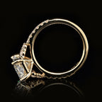 Full side profile shot displaying yellow gold basket setting and inner band stamp details