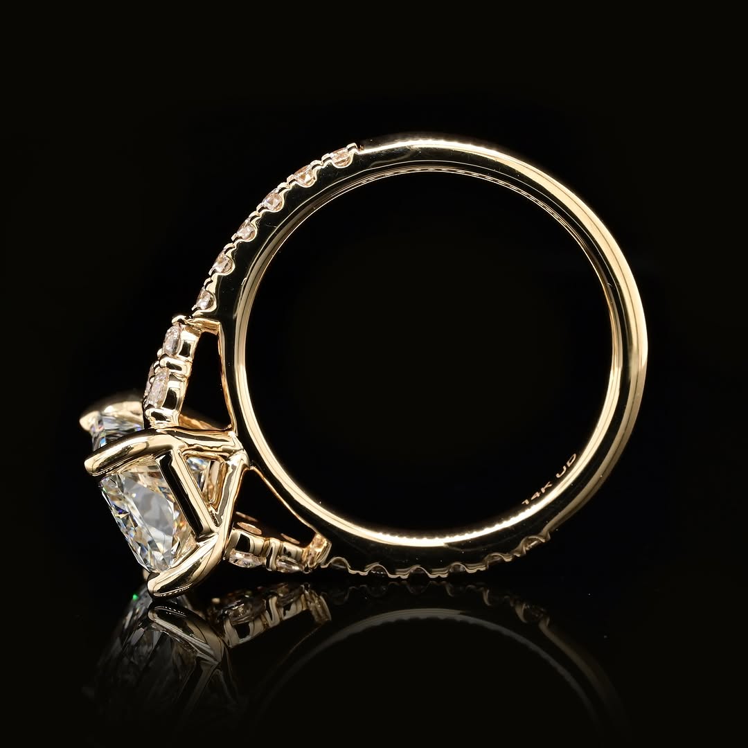 Full side profile shot displaying yellow gold basket setting and inner band stamp details