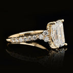 Close up view highlighting the brilliant facets of a 3CT radiant cut lab diamond with cluster accents
